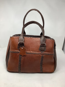 The hard leather hand bag